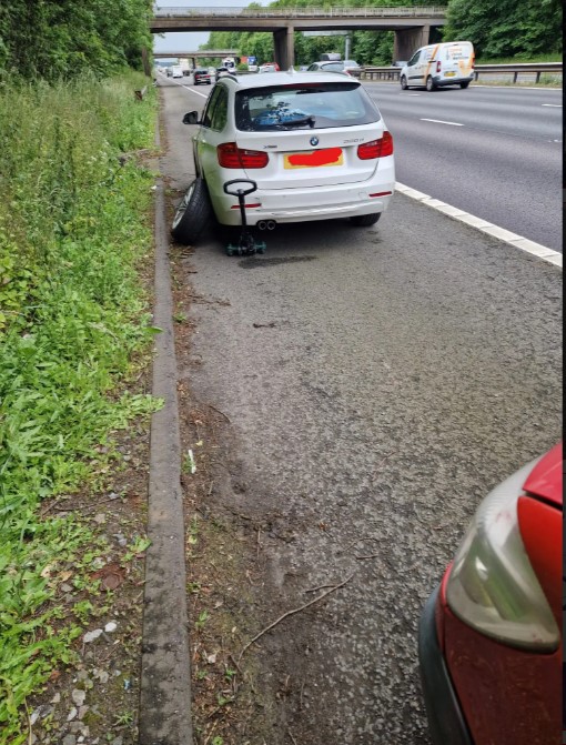BMW on the M6 hard shoulder — mobile fit in progress